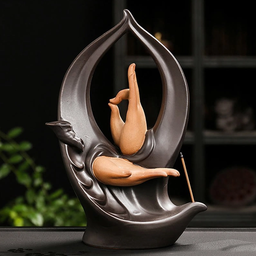Buddha Hand backflow incense burner side view with prayer mudra hands and curved base design in handcrafted ceramic