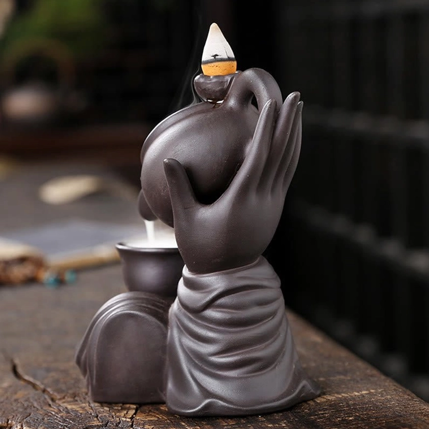 Left side profile of handmade Buddha hand backflow burner showing detailed ceramic craftsmanship
