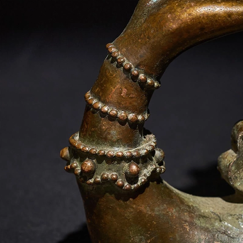 Macro photography of beaded wrist bands on bronze Buddha's hand lotus - multi-layer bracelet craftsmanship details