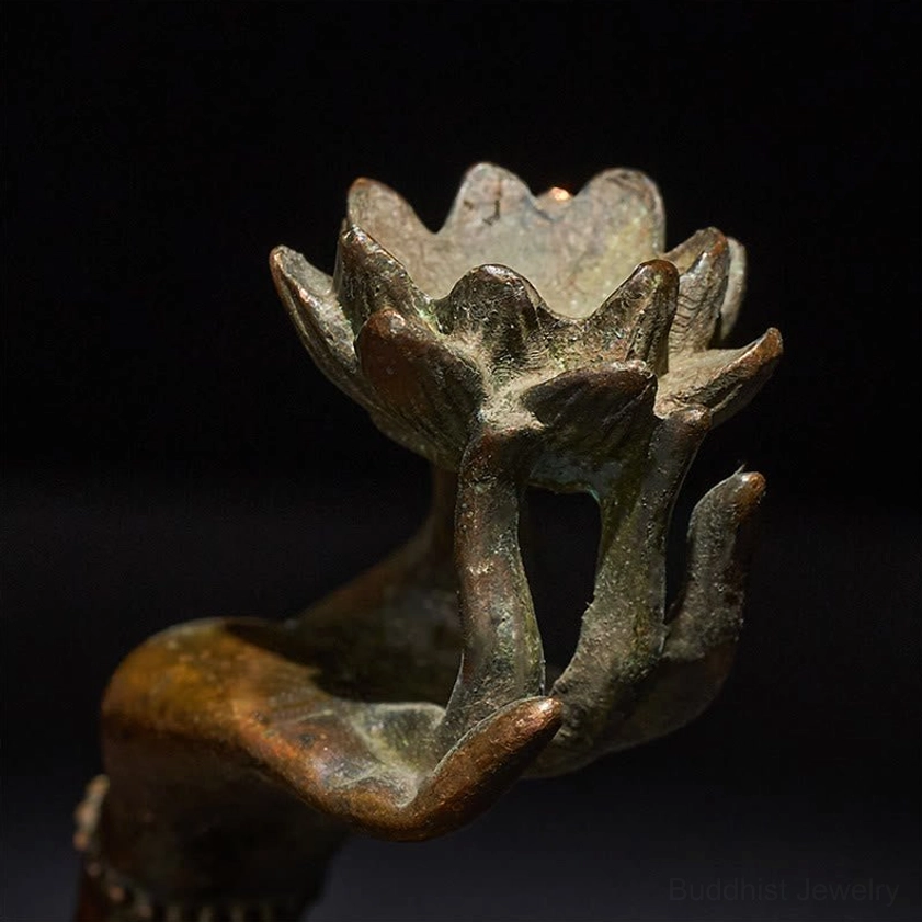 Close-up of carved lotus petal details on brass Buddha's hand lotus statue - intricate lotus holder carving