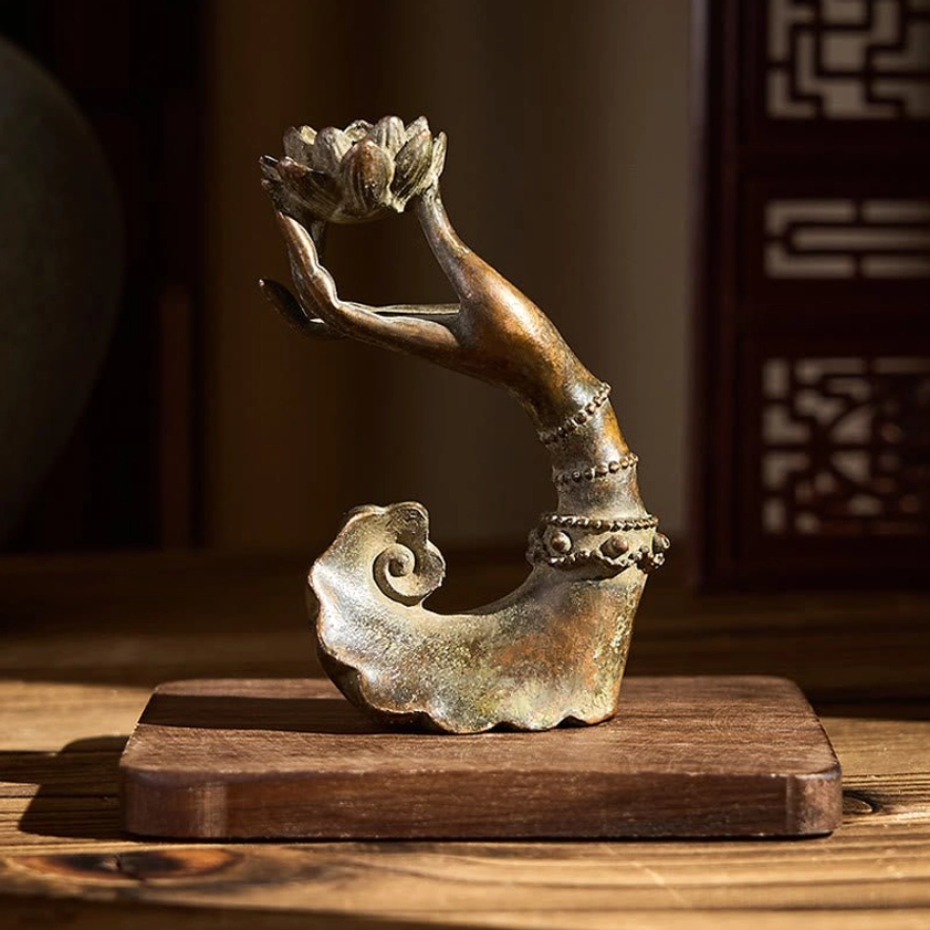 Buddha's hand lotus statue with ruyi base on wooden display stand - front three-quarter view with lattice background