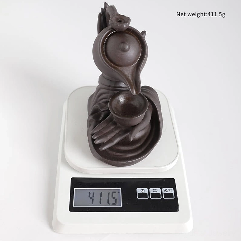 Buddha hand gesture backflow incense holder with flowing smoke for spiritual practice and relaxation