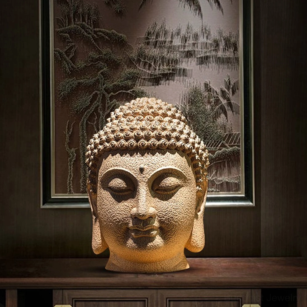 Meditating Buddha resin head statue in Chinese-style entryway with landscape wall art and natural lighting