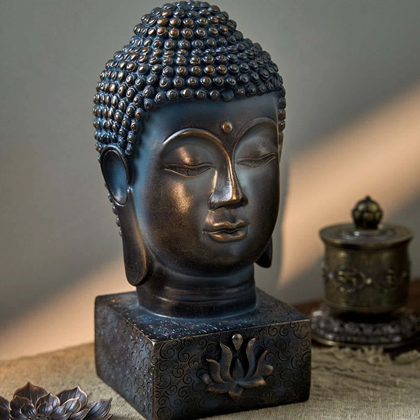 Buddha head meditation statue with dark bronze finish and lotus base carving, front three-quarter tabletop view for home spiritual décor