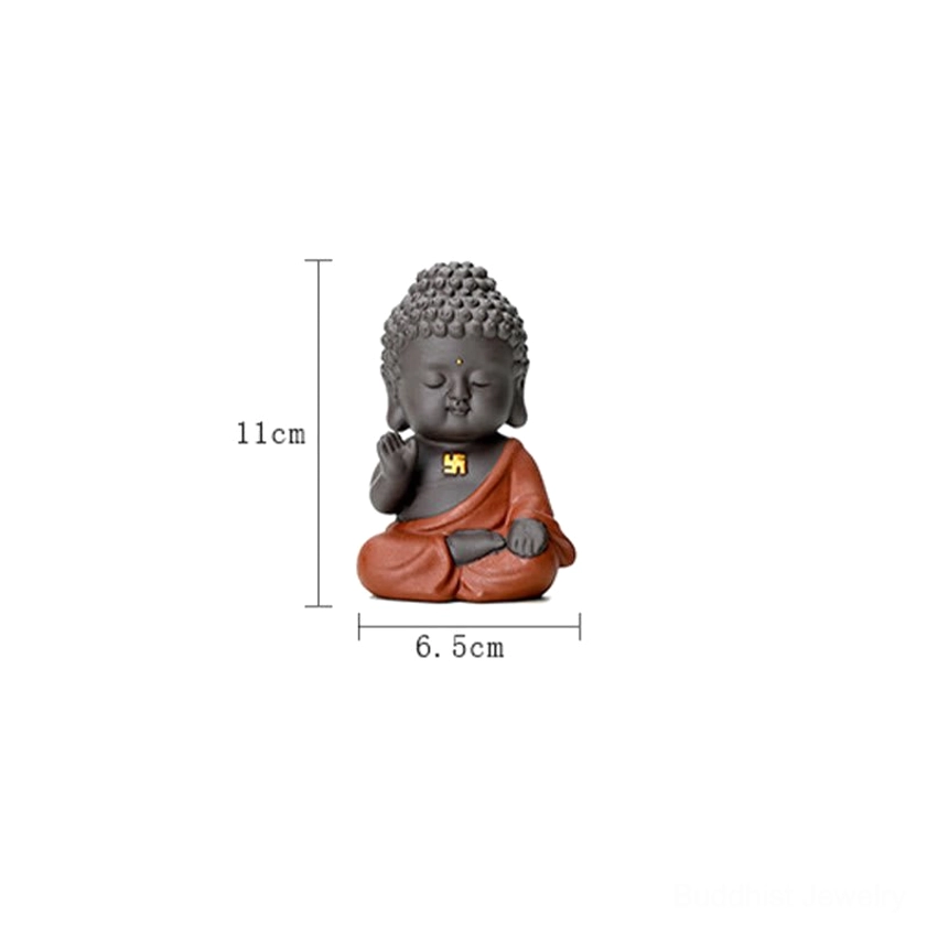 Small decorative Buddha statue showcasing traditional pose and craftsmanship, natural clay material for creating peaceful home environments
