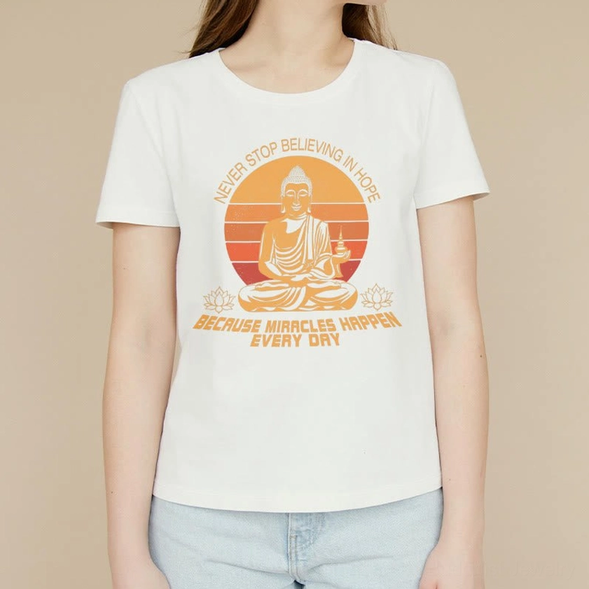 Buddha's Hope inspirational tee - model wearing off-white cotton shirt with retro Buddha design outdoor