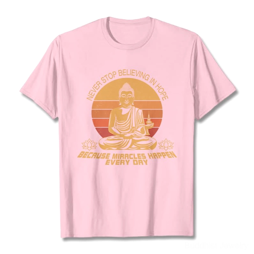 Buddha's Hope inspirational cotton tee flat lay - light pink base with retro Buddha design and hope quote