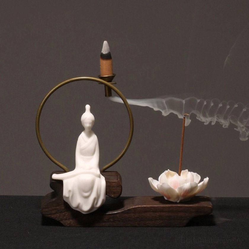 Formal seated Buddha figurine incense burner with winding incense smoke and natural wood base, Buddhist spiritual decoration