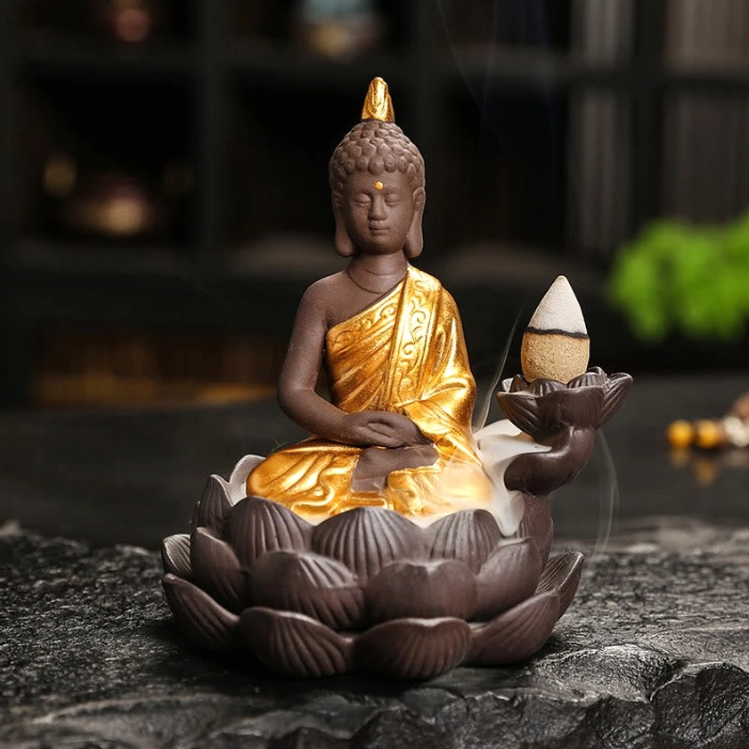 Buddha incense burner front facing view with visible backflow smoke waterfall effect, hand-painted ceramic robe detail