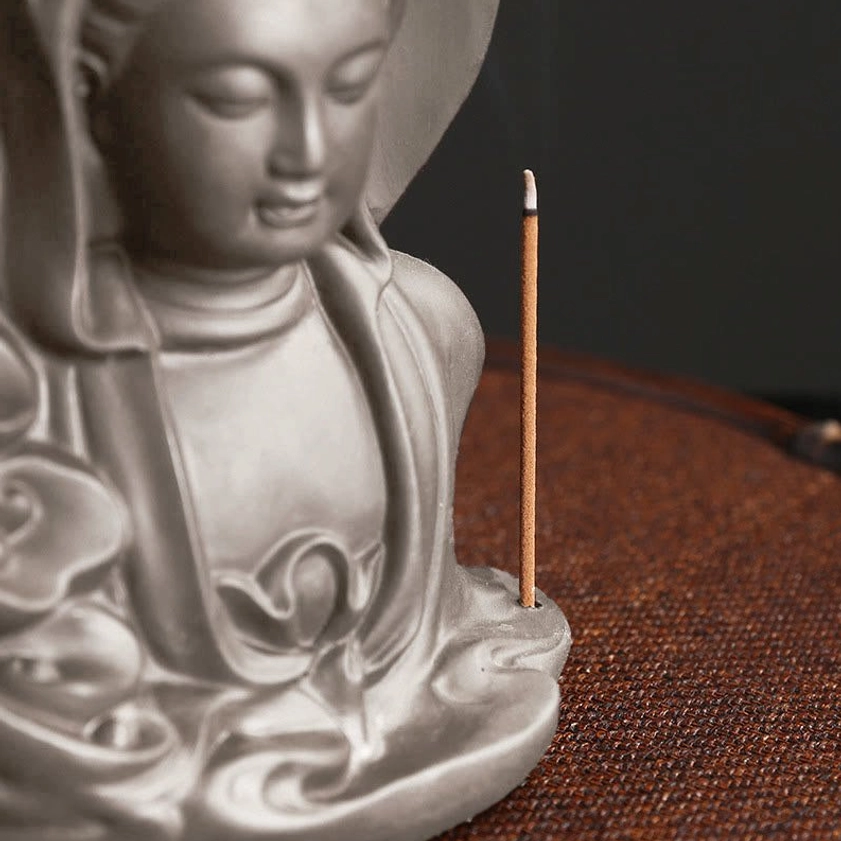 Buddhist Avalokitesvara incense burner upper body view with cloud pattern relief and standing incense