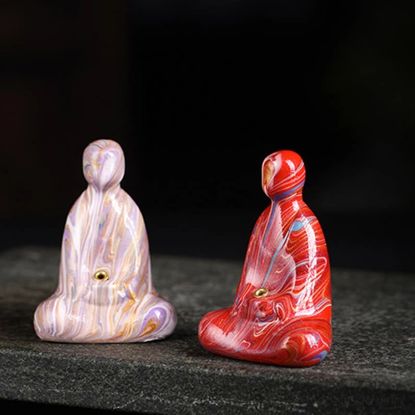 Multiple Buddha incense holders arranged together showcasing various marbled color options available