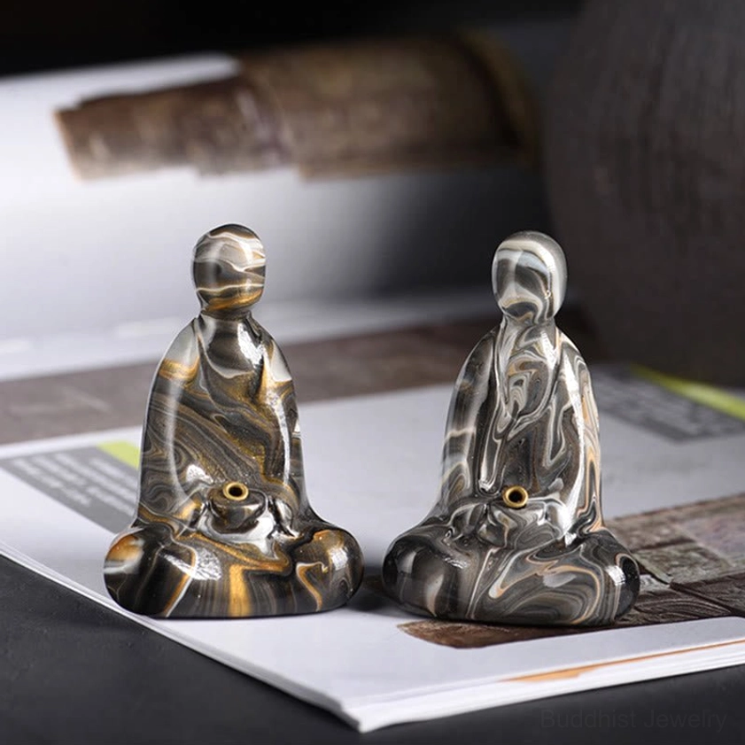 Detailed side view of Buddha incense holder showing smooth curved meditation pose silhouette