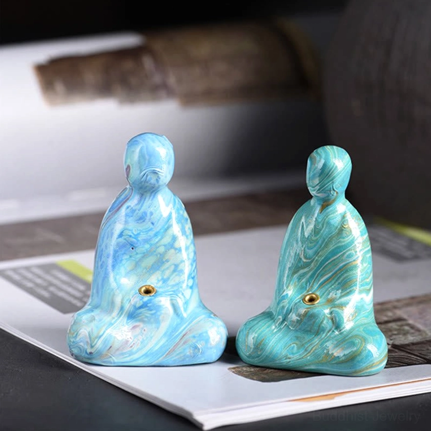 Buddha incense holder demonstration showing proper incense placement in sculpted torso socket