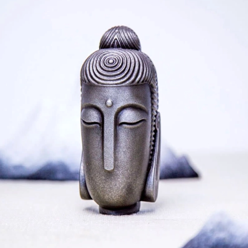 Meditating Buddha iron resin sculpture showing texture and patina for authentic spiritual decor