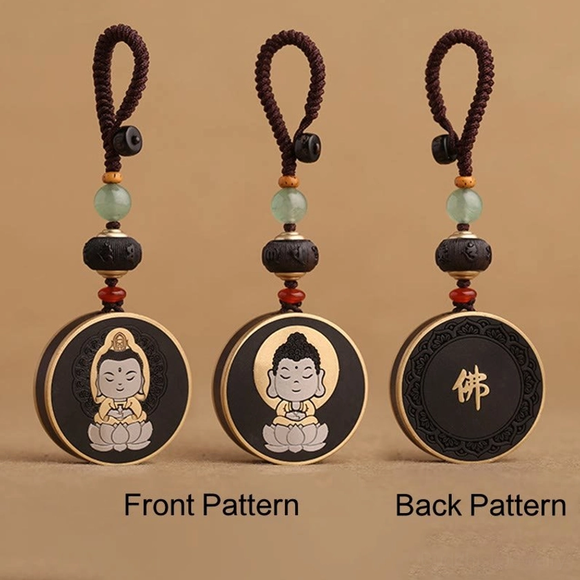 Set of Buddha keychains with front and back pendant designs on brown background