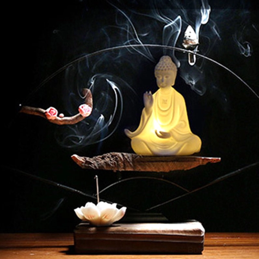 Buddha LED incense decoration set with warm backflow incense smoke and lotus incense holder on zen tea table