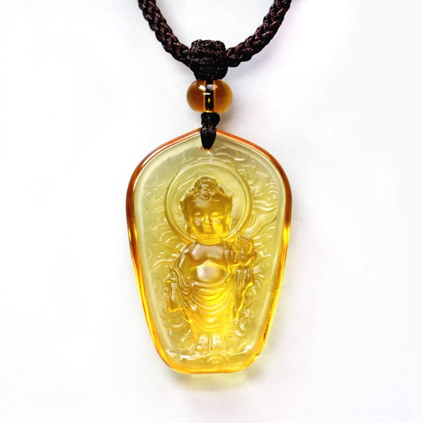 Amber Buddha Liuli crystal pendant - warm honey-toned glaze with embossed Buddha figure and cloud patterns