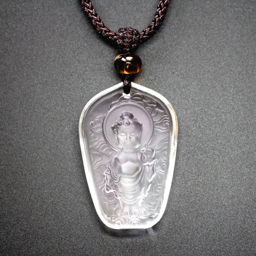 Clear carved Buddha Liuli crystal pendant - transparent glaze with embossed Buddha and cloud texture detail