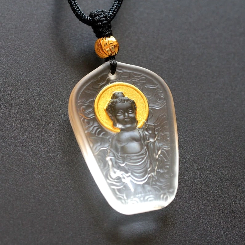 Transparent Buddha Liuli crystal pendant with golden halo - light-colored glaze featuring embossed Buddha and cloud motifs