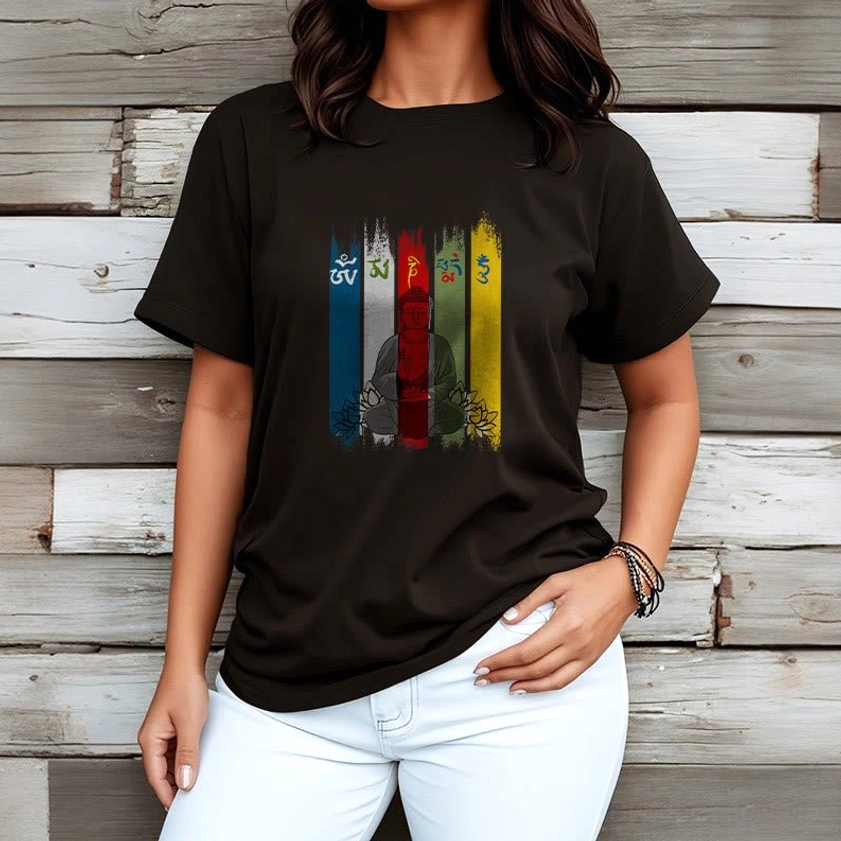 Black Buddhist lotus mantra t-shirt on female model half body front wooden panel background paired with white trousers