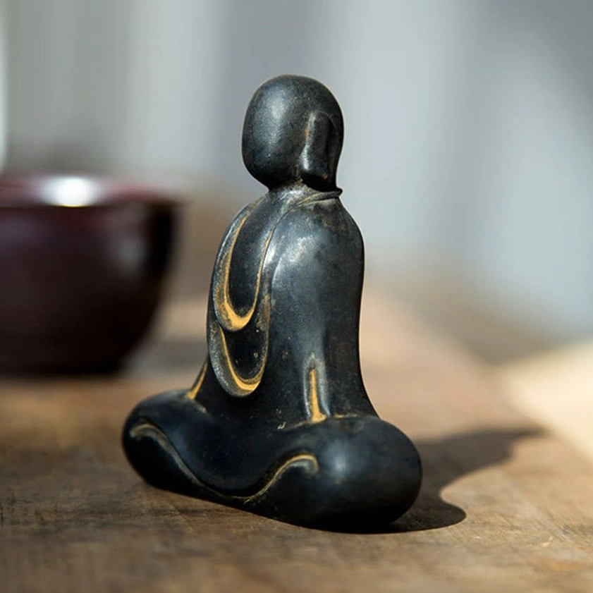 Buddha meditation figure in minimalist design perfect for peaceful space and spiritual practice