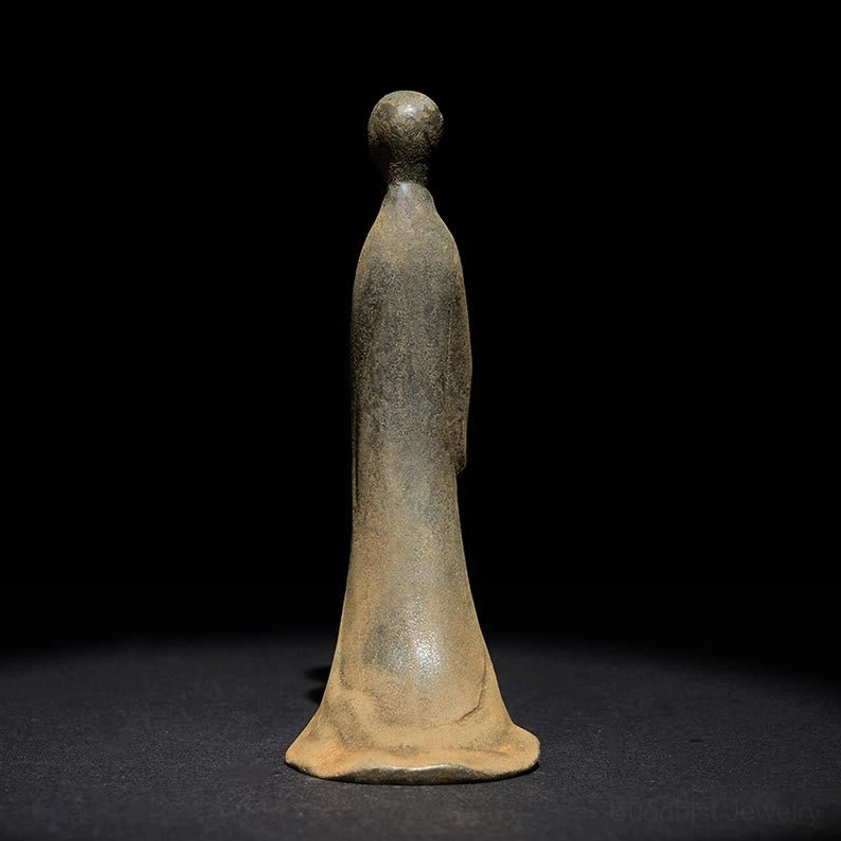 Rear view of minimalist Buddha sculpture showing smooth flowing robe and authentic weathered rust patina finish