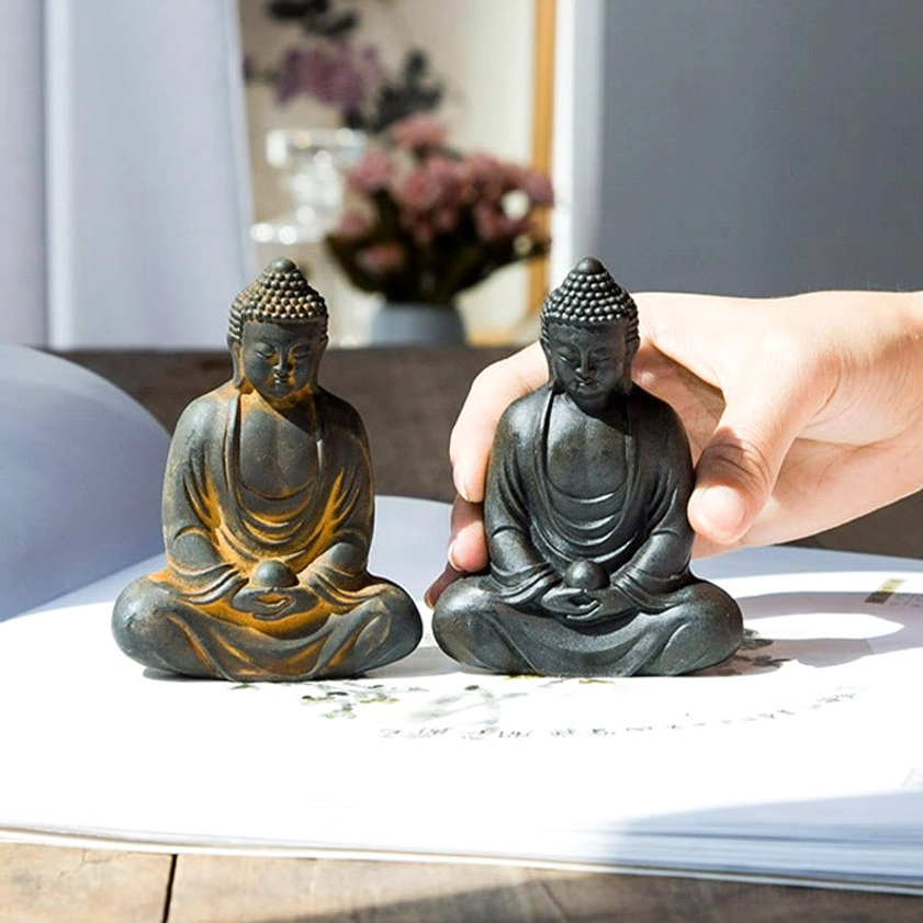 Meditating Buddha statue close-up of ushnisha crown and peaceful facial features