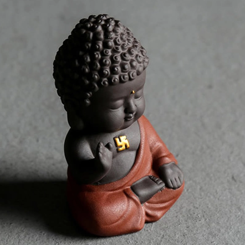 Handcrafted purple clay Buddha figurine, 3/4 front view with raised right hand, matte natural clay texture on dark background