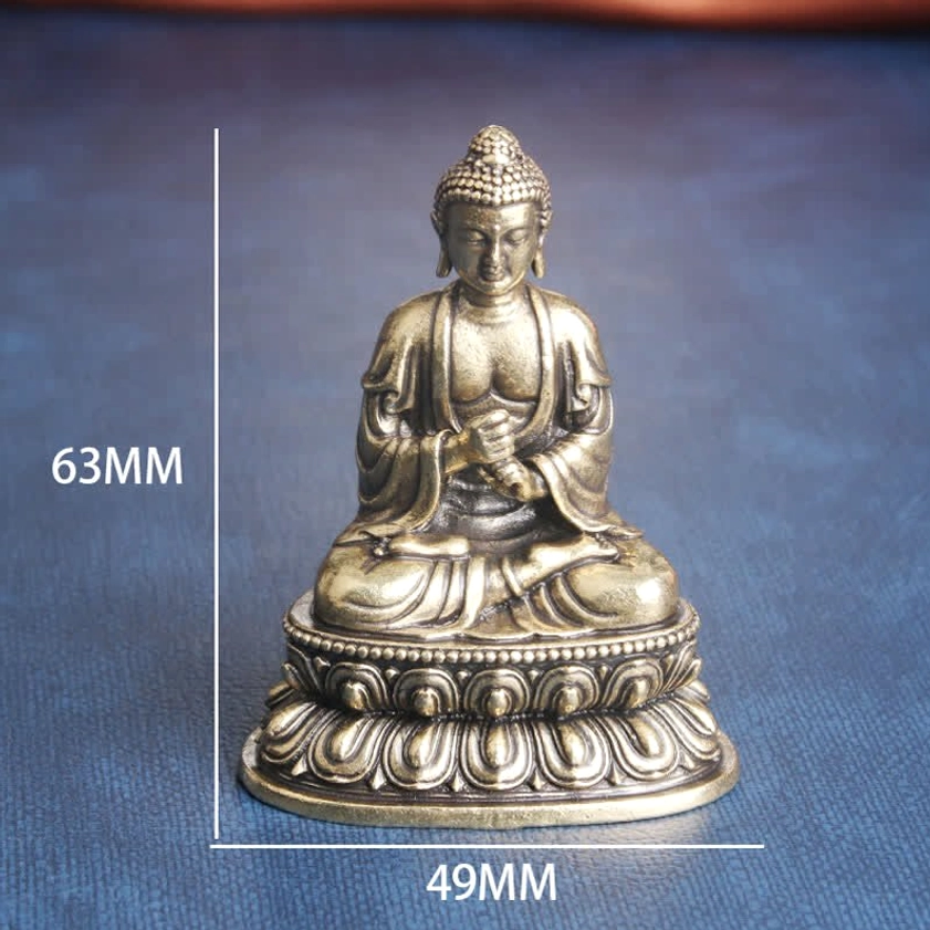 Size comparison of mini Buddha statue held in human palm, demonstrating compact portable meditation sculpture