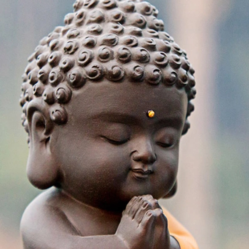 Handcrafted Buddha meditation statue, natural purple clay with traditional Buddhist symbolism, perfect for mindfulness practice spaces