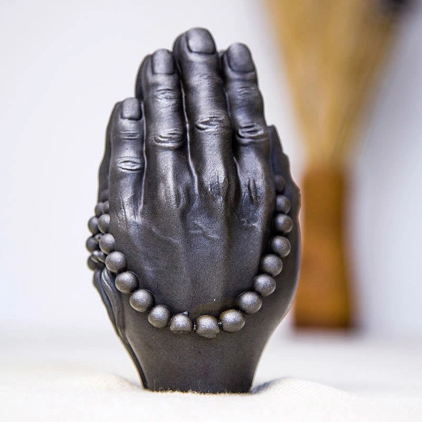 Buddha Namaste hand statue positioned on meditation altar space with calming ambiance for daily spiritual practice
