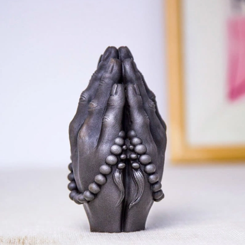 Buddha Namaste hand statue with traditional Buddhist symbolism and reverence gesture for creating peaceful atmosphere