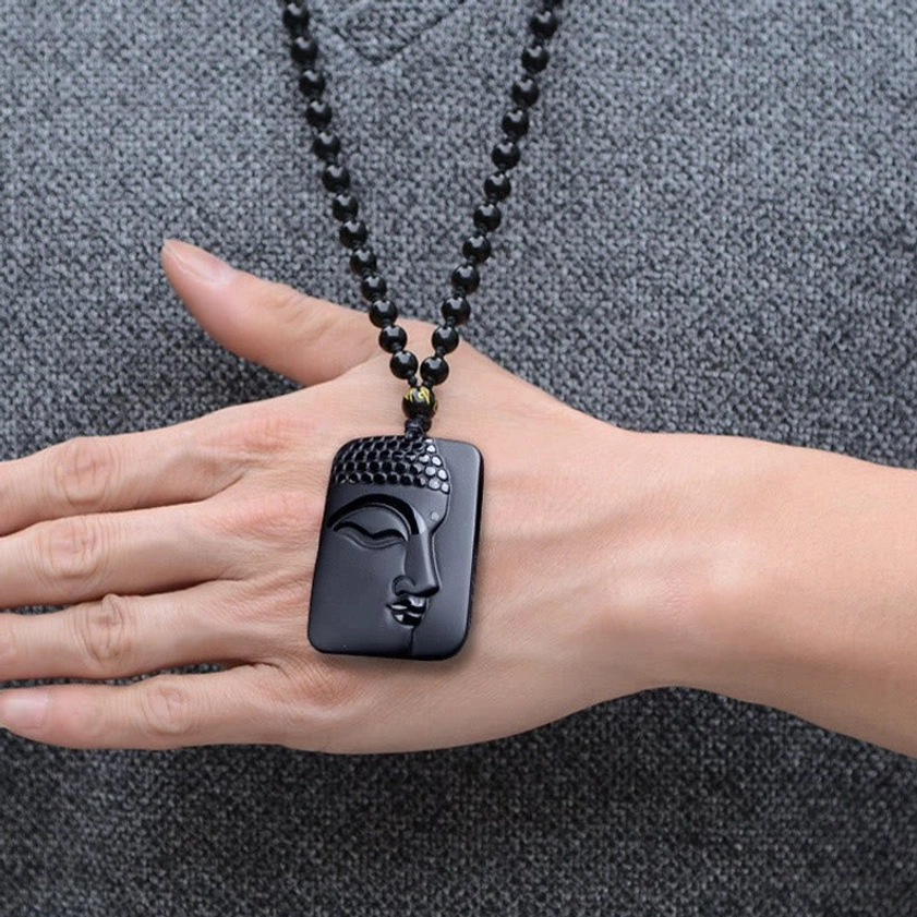 Spiritual Black Obsidian Buddha Necklace - Hand display shot showing compact square pendant size on adjustable beaded chain