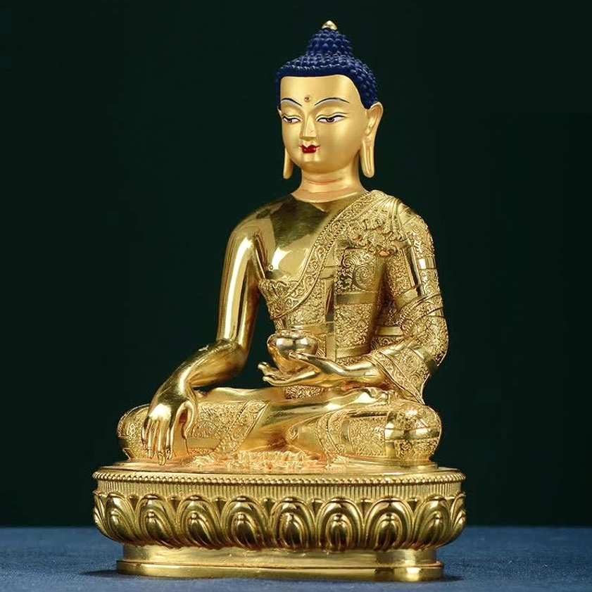 Shakyamuni Buddha offering statue frontal view with carved robes and decorative pedestal