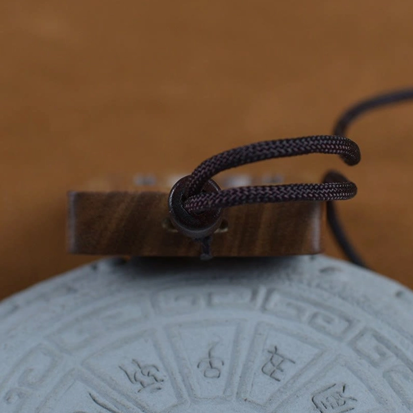 Green sandalwood Buddhist pendant necklace full length display showing complete rope cord and pendant proportions for sizing reference
