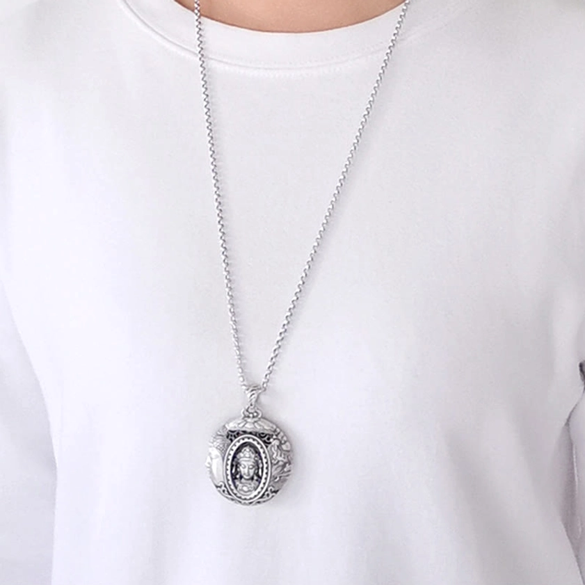 Wearable Buddhist necklace worn at collarbone on white top, showing pendant length and comfort fit for daily wear