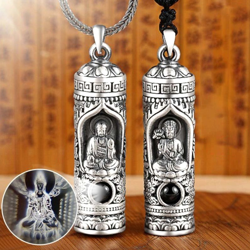Chinese zodiac guardian Buddha projection pendant close-up showing embossed relief texture and black gemstone accent