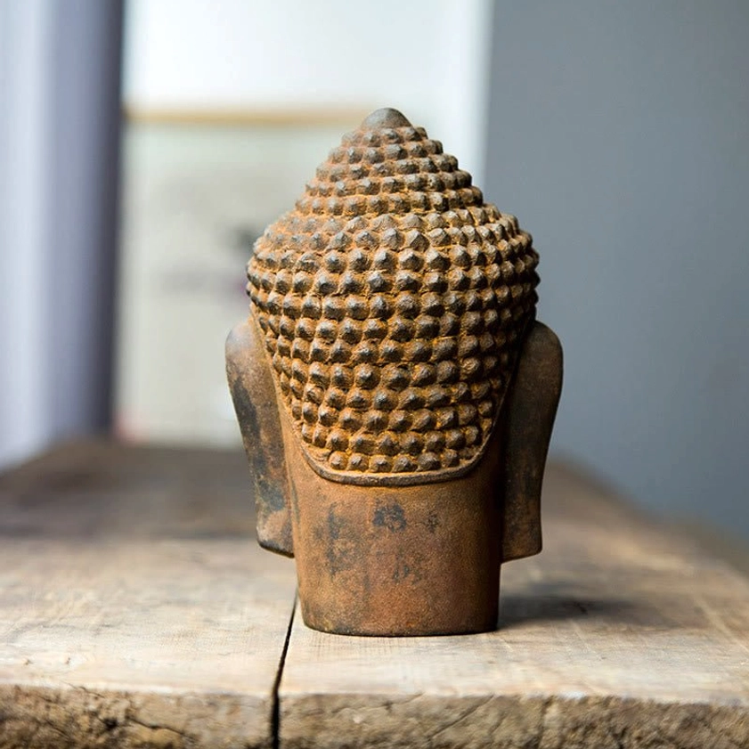 Back view of meditating Buddha statue showing rear of spiked hair bun and handcrafted details