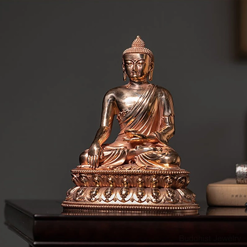 Buddha statue in earth-touching mudra position with calm serene expression