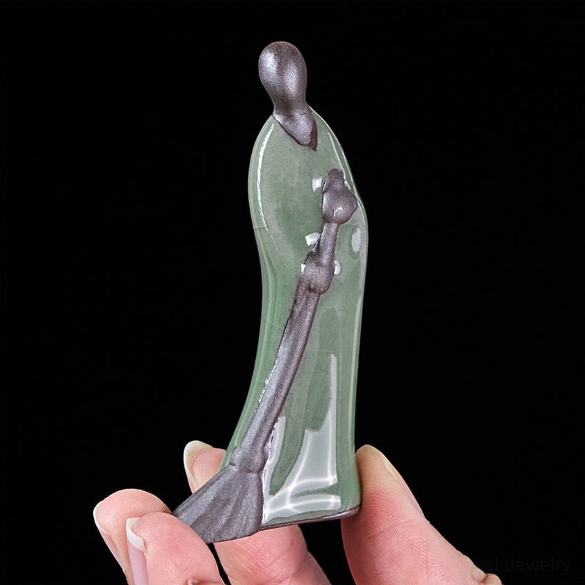 Faceless Buddha handcrafted ceramic statue rear angle in palm showing detailed bronze broom and size for meditation room