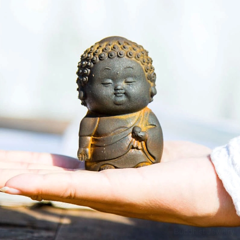 Buddha statue collection detail shot showing hand-poured iron powder resin craftsmanship and surface texture