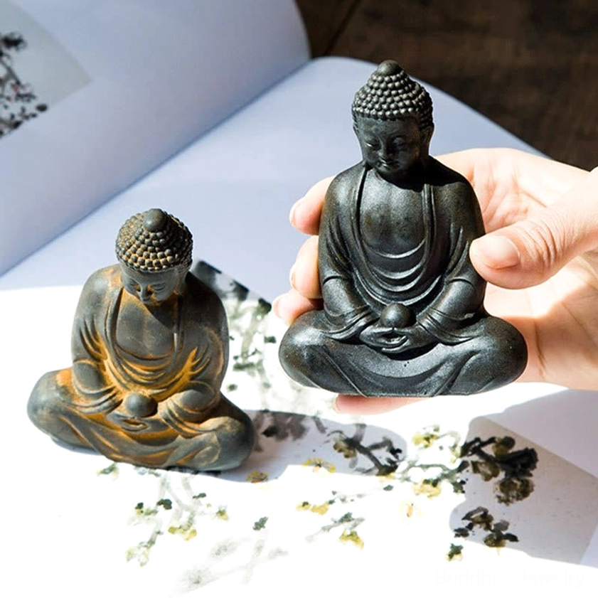 Meditating Buddha resin statue with naturalistic weathered iron powder finish and texture
