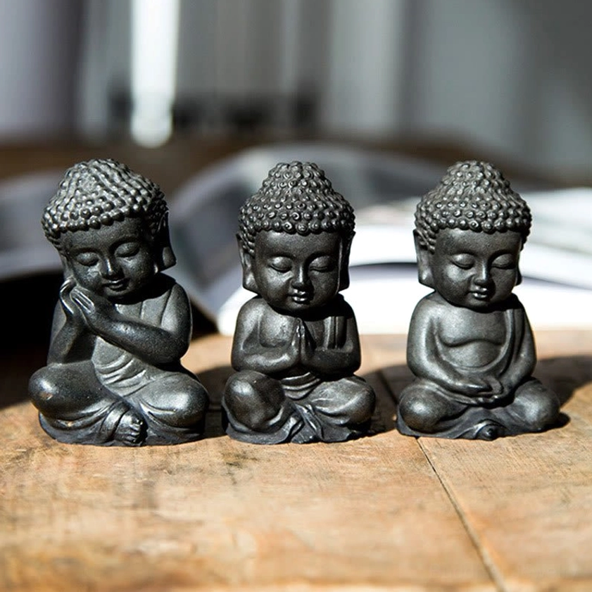 Buddha figurine detail shot showing iron powder resin texture - handcrafted artistic surface finish