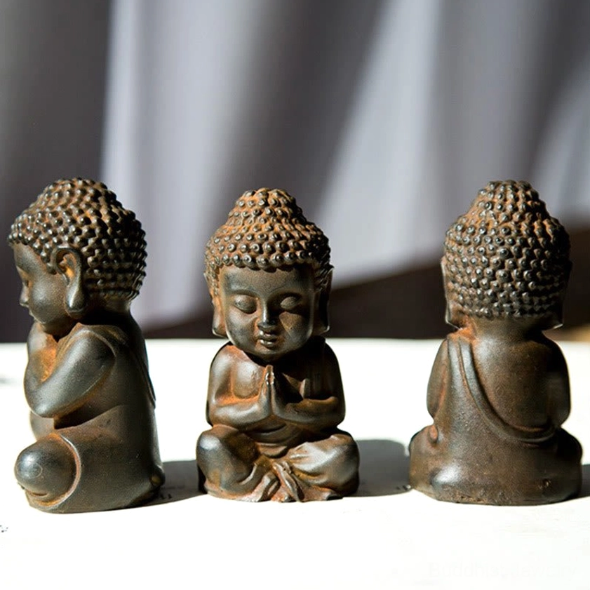 Small Buddha decorative statues showing multiple angles - front side and back views on white background