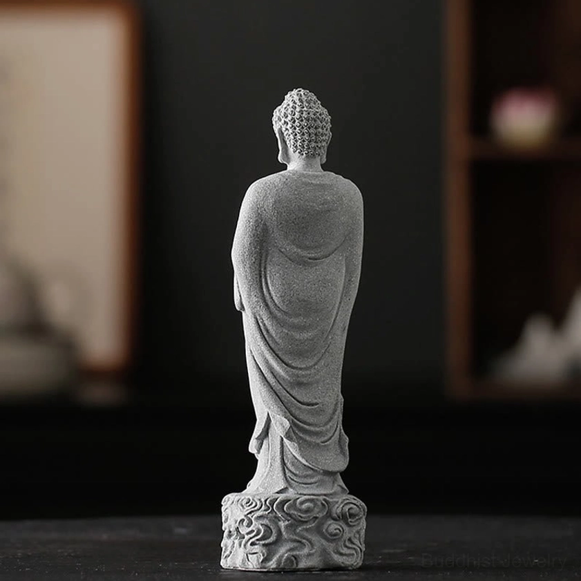 Back full-body view of Buddha meditation statue with intricate robe folds