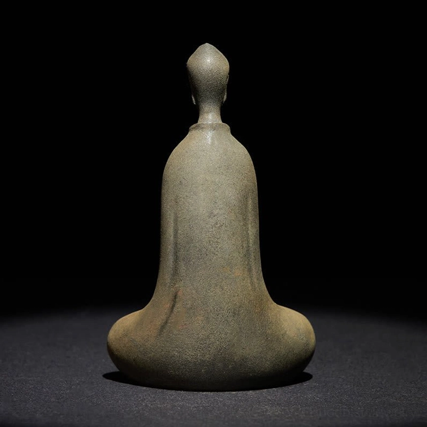 Rear view of handcrafted Buddha statue showing back detail and uniform matte surface