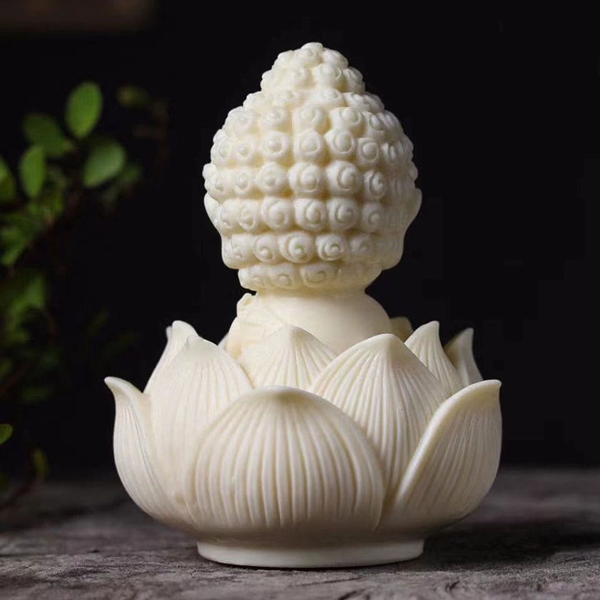 Rear view of Tathagata Buddha statue showing carved curly hair bun and detailed lotus petals