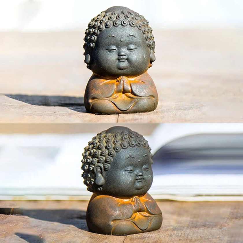 Buddha statue with rustic brown patina finish showing aged vintage aesthetic on natural wooden background