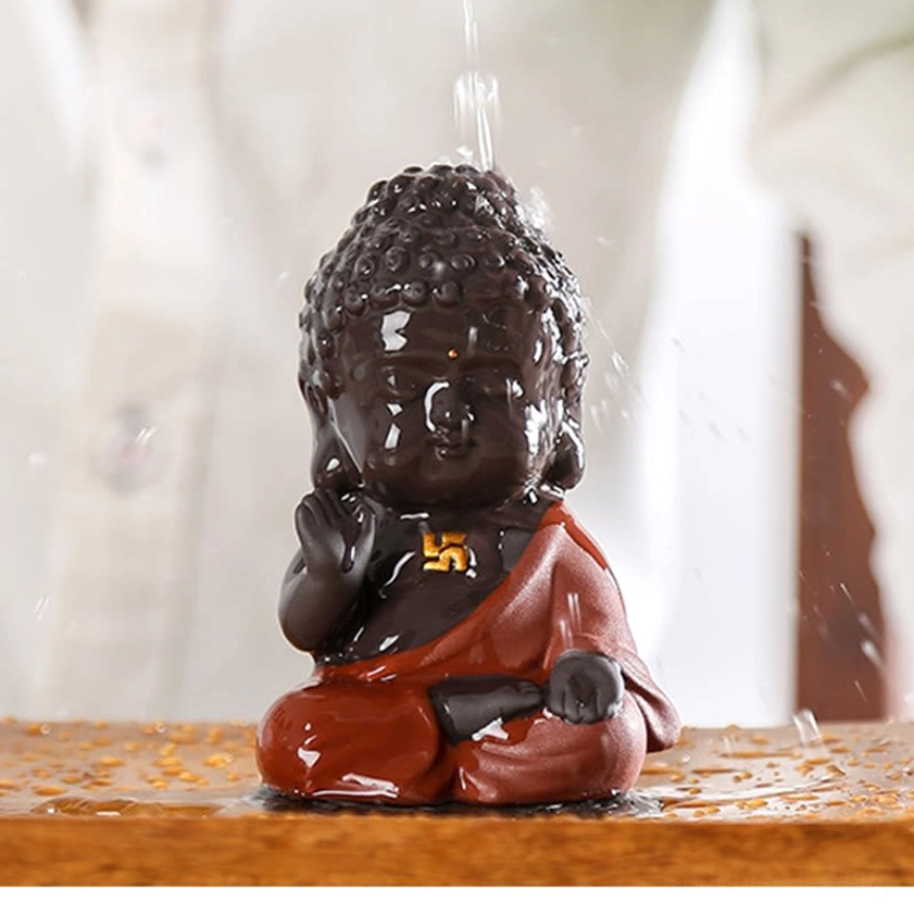 Small Buddha statue in peaceful seated position, purple clay material with traditional design elements, ideal for meditation spaces