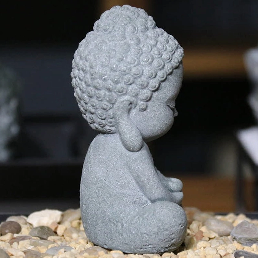 Side profile view of mini Buddha figurine in cross-legged seated pose, grey matte sandstone, perfect for zen garden display
